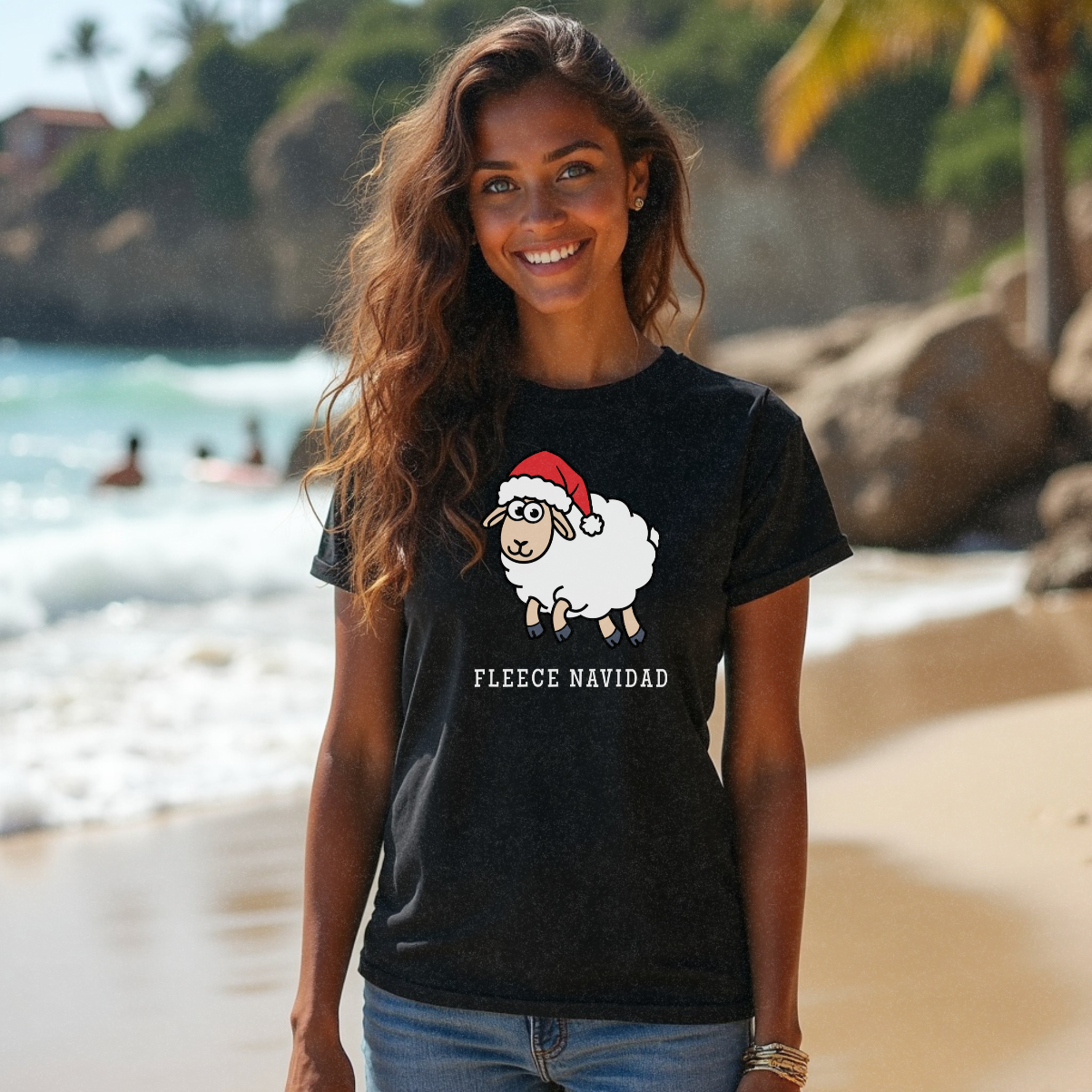 Young female with long brunette hair modelling n the beach in a funny black Christmas t-shirt that says 'Fleece Navidad' by Faith Looks Good